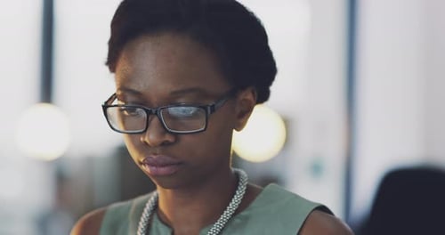 Thinking business woman working late in office at night for deadline, overtime
