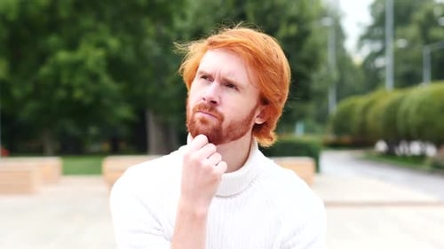 Portrait of Thinking Pensive Man Outdoor