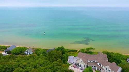 Cape Cod High Tide Drone Footage of Houses and Boat at Sea