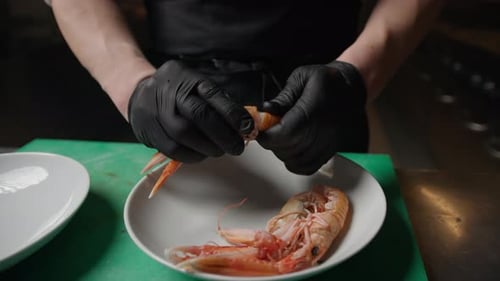 Chef Hands Shelling a Raw Crustacean Close Up