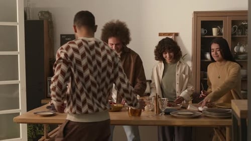 Friends Preparing Food Together in Kitchen