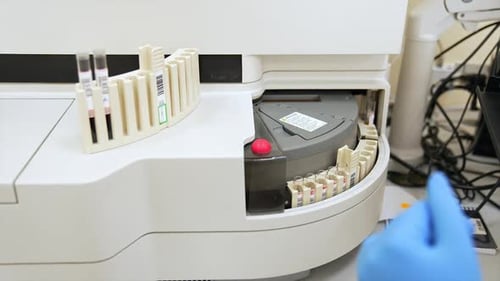 Medical Machine Scans Blood Sample Vials