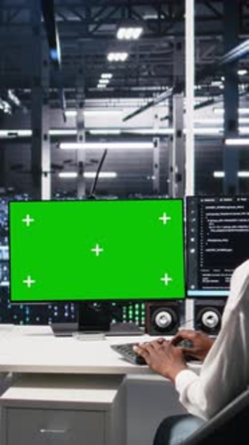 Vertical Video Female Technician and Coworker in Data Center Review AI Diagnostics on Mockup PC