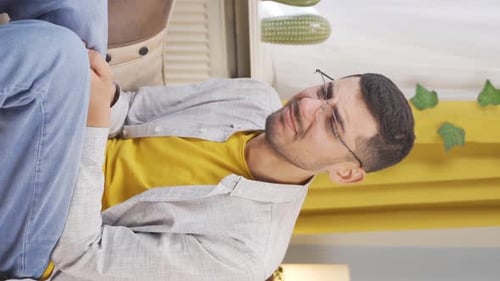 Vertical video of Sad man is crying.