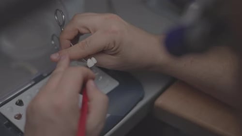 Dental Technician Crafting Implants in a Professional Lab