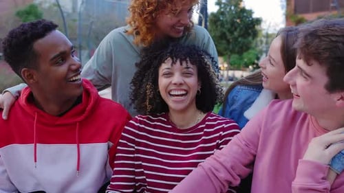 Friends Laughing Together in an Urban Park