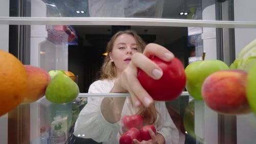View From Inside the Fridge Woman Opens Side By Side Fridge Doors Puts Tomatos Then Closes It Female