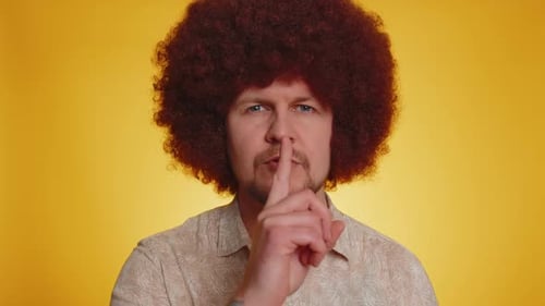 Young Man Presses Index Finger to Lips Makes Silence Gesture Sign Do Not Tells Secret Shh Be Quiet