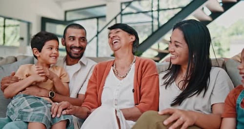 Happy Multi-Generational Family Laughing and Relaxing at Home