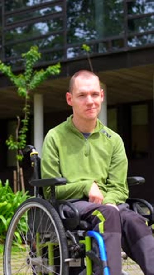 Proud Man with Disability in the University Campus