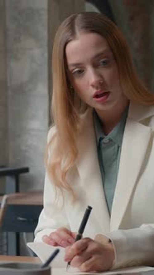 Caucasian Business Woman in Office Writing Notes Listening Online Video Call Businesswoman Corporate