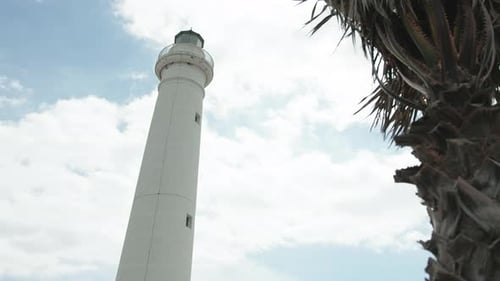 Lighthouse Tower Under Cloudy Sky