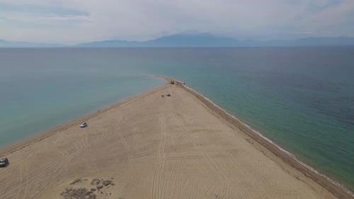 4k sideways moving clip over a peninsula on the tropical beach of Epanomi, Halkidiki, Greece