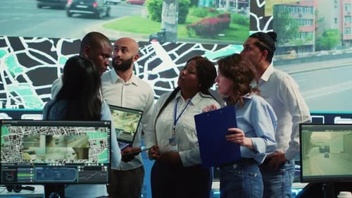 Diverse Team Collaborating on Project in Modern Office