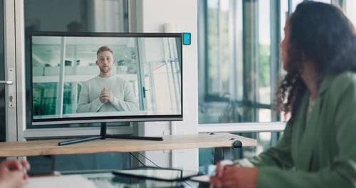 Team Meeting with Video Call in Modern Workplace