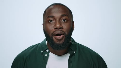 Man with beard shocked, surprised, excited reaction closeup