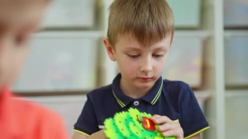 Closeup of a Boy Doing a Task in Kindergarten Educational Lessons for Children