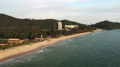 Magical view of Pantai Tenga beach and tourists on Langkawi Island during sunset. Malaysia