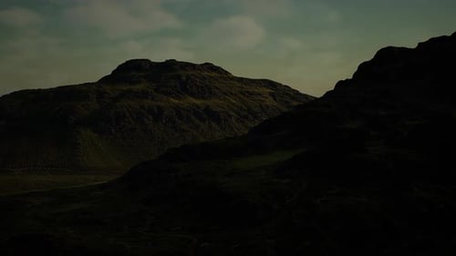 Dusk Casts Luminous Spell Across Rugged Terrain and Sprawling Shadowed Valleys
