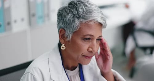 Senior Woman Working in a Medical Setting