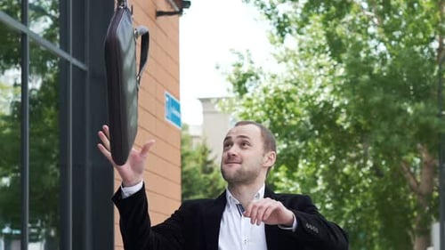 Successful startup partner celebrates victory near the office center in slow motion