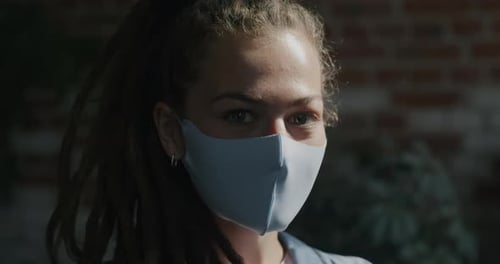 Young Adult Woman Wearing Mask Close Up