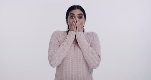 Woman reacting with shock in a studio