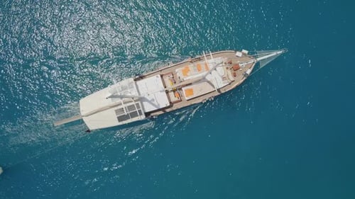 Aerial View of Boat Sailing on Blue Water