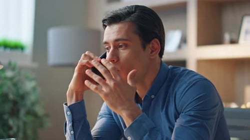 Nervous Worker Calling Cellphone at Office Close Up. Angry Man Arguing Mobile