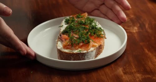 Close up of a toast with cream cheese and salmon