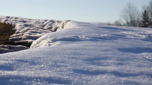 Closeup Of Snow Crystals On Ground Glittering In Sunlight.