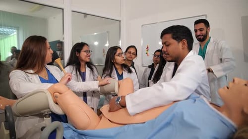 Medical Students Training with Mannequin in Workplace Setting
