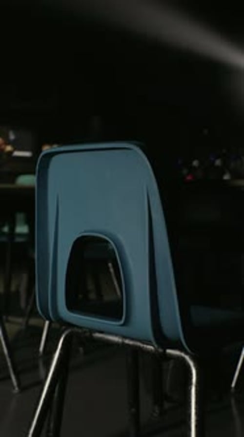 A Row of Blue Chairs Sitting Next to Each Other