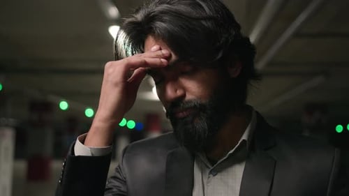 Stressed Frustrated Indian Man in Underground Parking Lot Suffering From Tension Disappointed Male