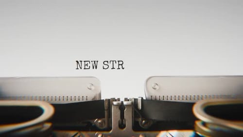 Old mechanical typewriter typing New Strategies Proposed in a close-up view.
