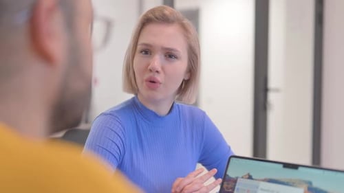 Close up of Blonde Woman Talking with Creative Teammate