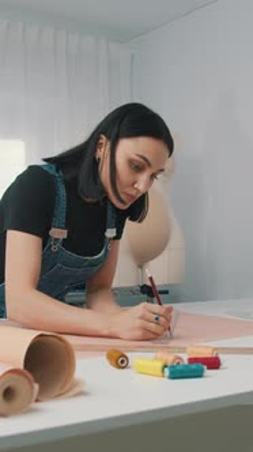 Woman Designs Pattern in Studio