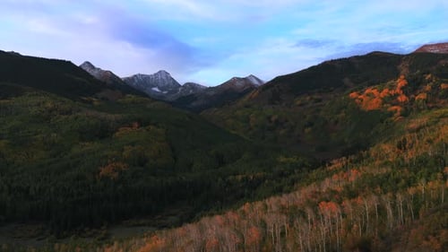 Breathtaking Autumn Sunset Over Majestic Snow Capped Mountain Peaks Landscape