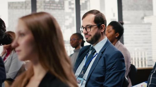 People Attending a Conference in Modern Business Setting