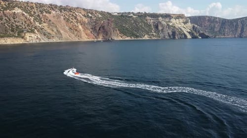 Jet Ski Tows Tube in Coastal Waters