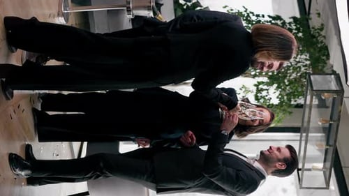 vertical video a company of friends celebrating a birthday or New Year in a restaurant with glasses