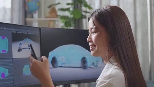 Young Woman Designing Car Model at Desk