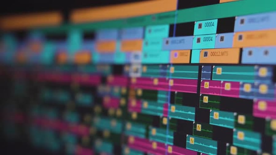 Video editing. Playhead moving through a complex timeline. Screen close ...