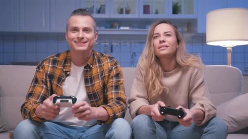 Couple Playing Video Games Together at Home