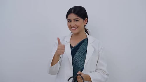 Indian Female Doctor Removing Stethoscope and Feeling Happy