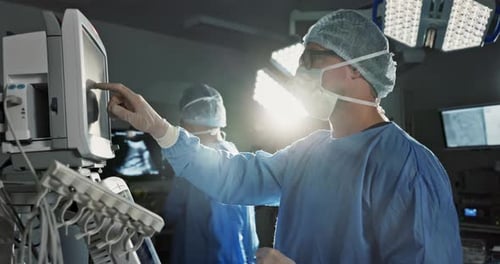 Team, surgeon and press monitor in hospital, clinic and operation theater