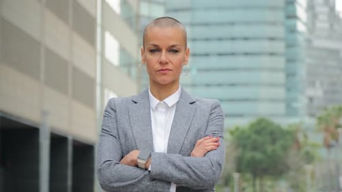 Confident Businesswoman Posing in Front of Office Building