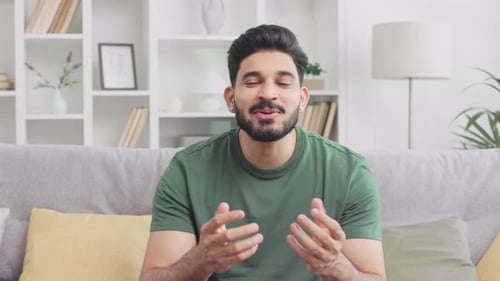 Man Talking and Gesturing Indoors