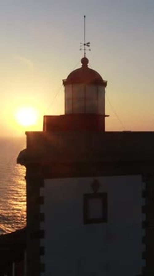 Vertical Video of Lighthouse at Sunset. Cabo Carvoeiro, Peniche, Portugal Aerial View