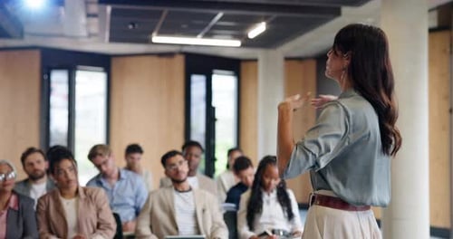 Business Conference: Woman Speaking to a Group of People